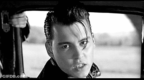 Black And White Photo Of Young Man Sitting In Car GIF