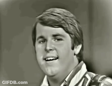 Black And White Photo Of Young Man Smiling GIF
