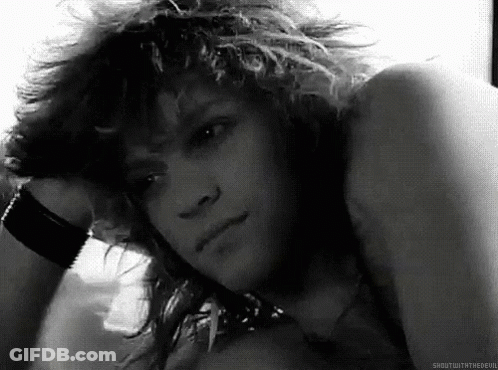 Black And White Photo Of Young Man With Curly Hair GIF