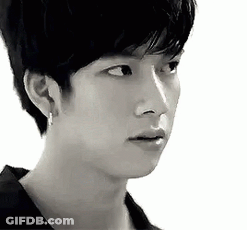 Black And White Photo Of Young Man With Serious Look GIF