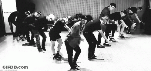 Black And White Photo Of Young Men Dancing On Stage GIF