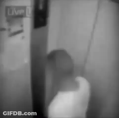 Black And White Photo Person Standing In Front Of Live Sign GIF