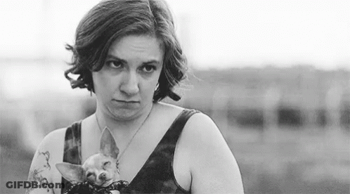 Black And White Photo Woman Holding Small Dog GIF