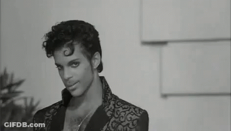 Black And White Prince In Suit And Necklace GIF