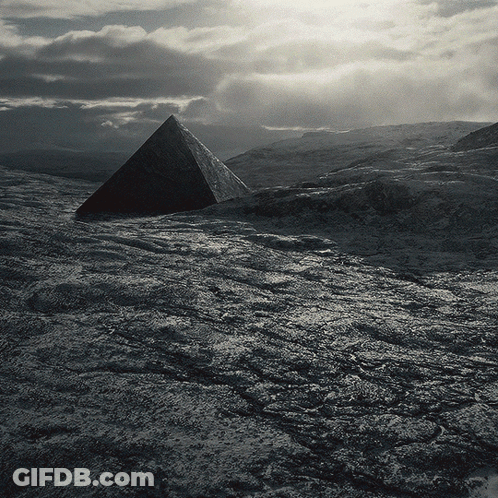 Black And White Pyramid In Rocky Field GIF