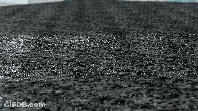 Black And White Rain On Brick Floor GIF