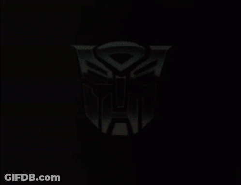 Black And White Robot Holding Yellow Object GIF