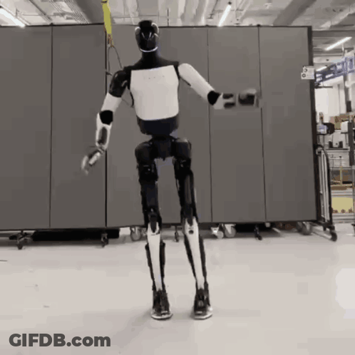 Black And White Robot In Front Of Number 6 GIF