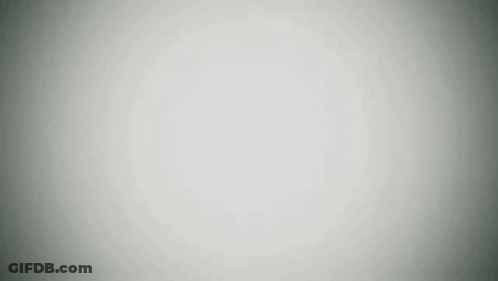 Black And White Robot With Helmet On Snowy Field GIF