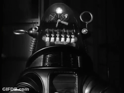 Black And White Robot With Light On Head GIF