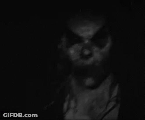 Black And White Scary Face In The Dark GIF