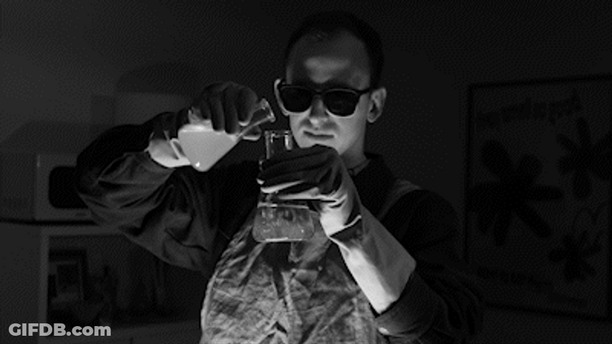 Black And White Scientist Mixing Chemicals GIF