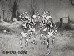 Black And White Skeletons Dancing In Cemetery GIF