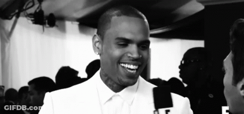 Black And White Smiling Man With F On Shirt GIF