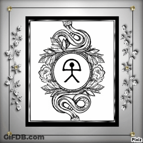 Black And White Snake Surrounded By Flowers And Leaves GIF
