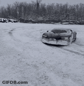 Black And White Snow Photo Of Car With Bugatti On Front GIF