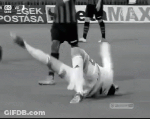 Black And White Soccer Player Falling On Field GIF