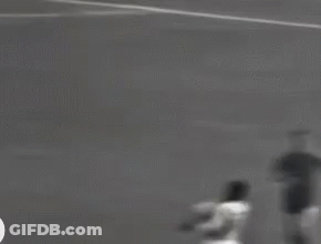 Black And White Soccer Player Kicking Ball GIF