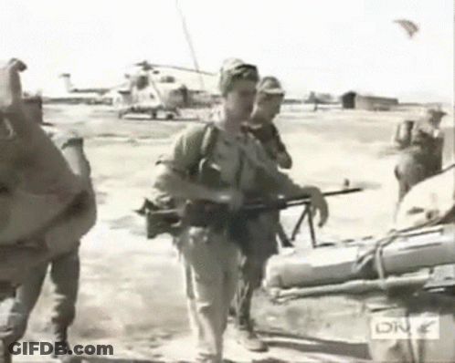Black And White Soldiers Carrying Helicopter GIF