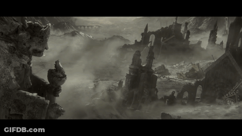 Black And White Statue In Front Of Ruined City GIF