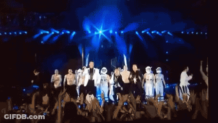 Black And White Stick Figures Standing Around Person GIF