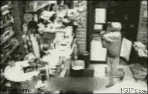 Black And White Store With Person Standing GIF