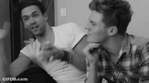 Black And White Two Men Talking On Couch GIF