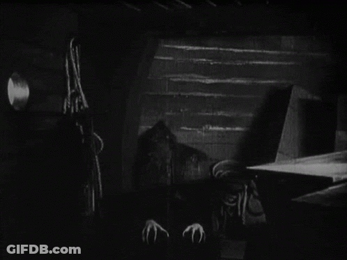 Black And White Vampire With Long Claws GIF