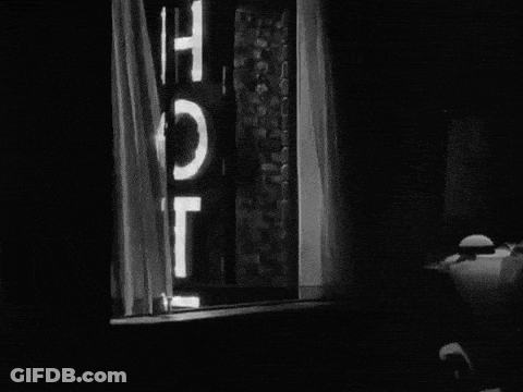Black And White Window With Hotel Sign GIF