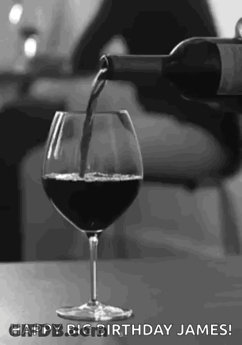 Black And White Wine Being Poured Into Glass GIF