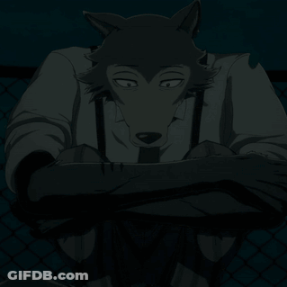 Black And White Wolf With White Shirt And Suspenders GIF