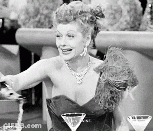 Black And White Woman At Table With Martini Glass GIF