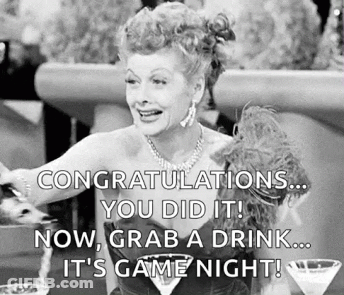 Black And White Woman At Table With Martini GIF