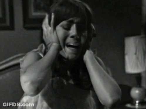 Black And White Woman Covering Ears GIF