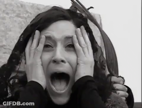 Black And White Woman Covering Face GIF