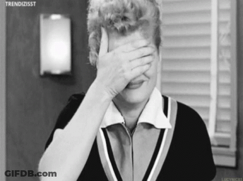 Black And White Woman Covering Face With Hand GIF