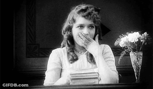 Black And White Woman Covering Mouth GIF