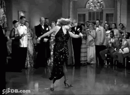 Black And White Woman Dancing In Front Of Crowd GIF