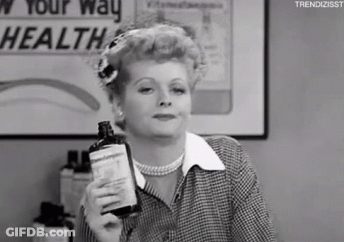 Black And White Woman Holding Bottle GIF