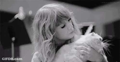 Black And White Woman Holding Cat GIF