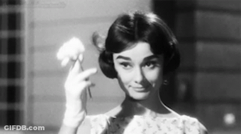 Black And White Woman Holding Flower GIF