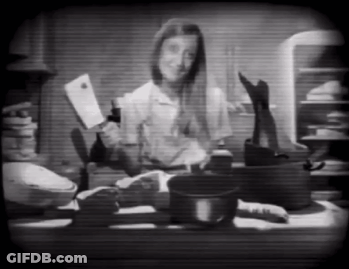 Black And White Woman Holding Knife And Bottle GIF