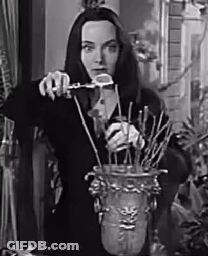 Black And White Woman Holding Vase GIF