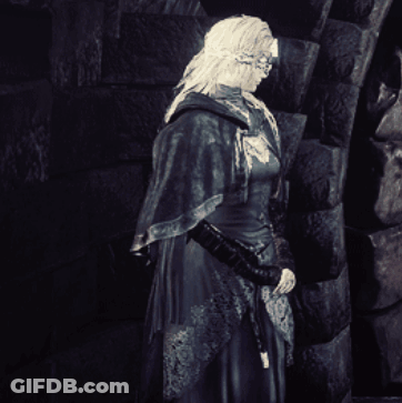 Black And White Woman In Front Of Brick Wall GIF