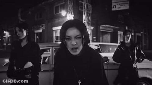 Black And White Woman In Front Of Car GIF