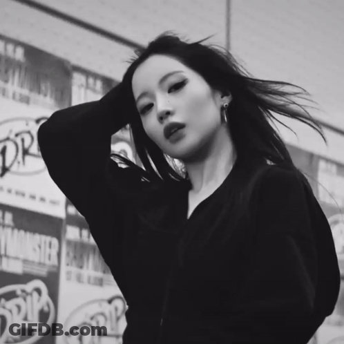 Black And White Woman In Front Of Monster Advertisement GIF