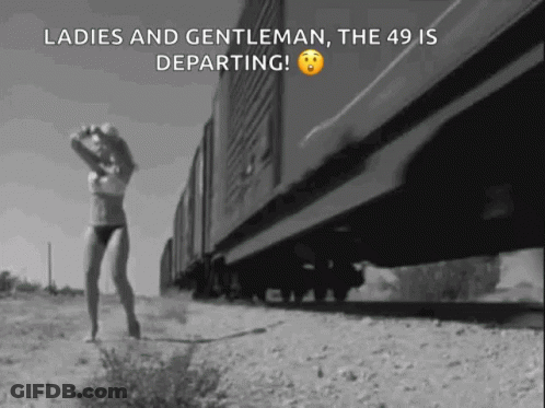 Black And White Woman In Lingerie Walking Beside Train GIF