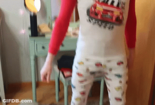 Black And White Woman In Patterned Shirt GIF