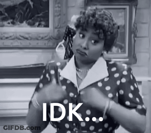 Black And White Woman In Polka Dot Dress Saying Idk GIF