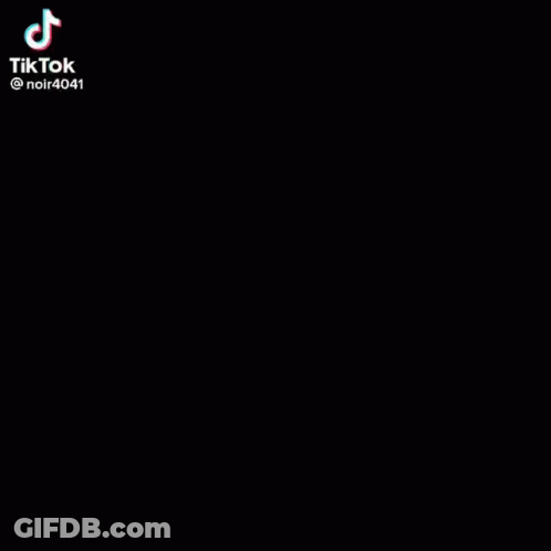 Black And White Woman In Suit On Stairs GIF